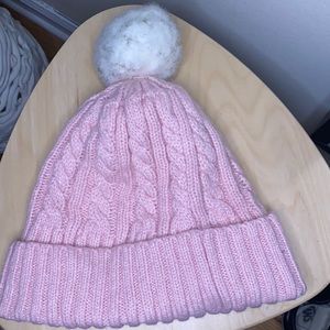 Pink cabled pom pom hat